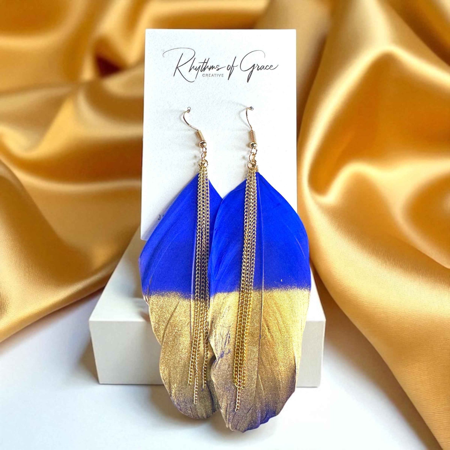 Gold Dipped Feather Earrings: Dance Into the Festivity!
