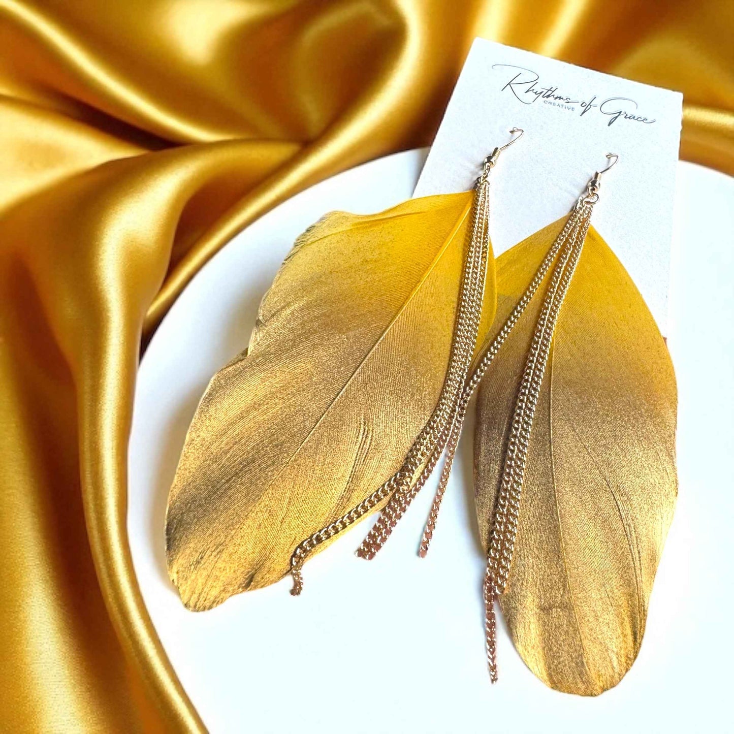 Gold Dipped Feather Earrings: Dance Into the Festivity!