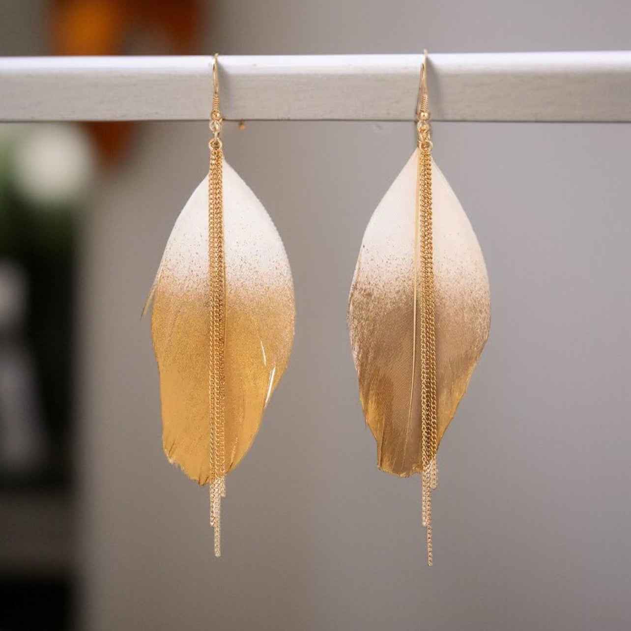 Gold Dipped Feather Earrings: Dance Into the Festivity!