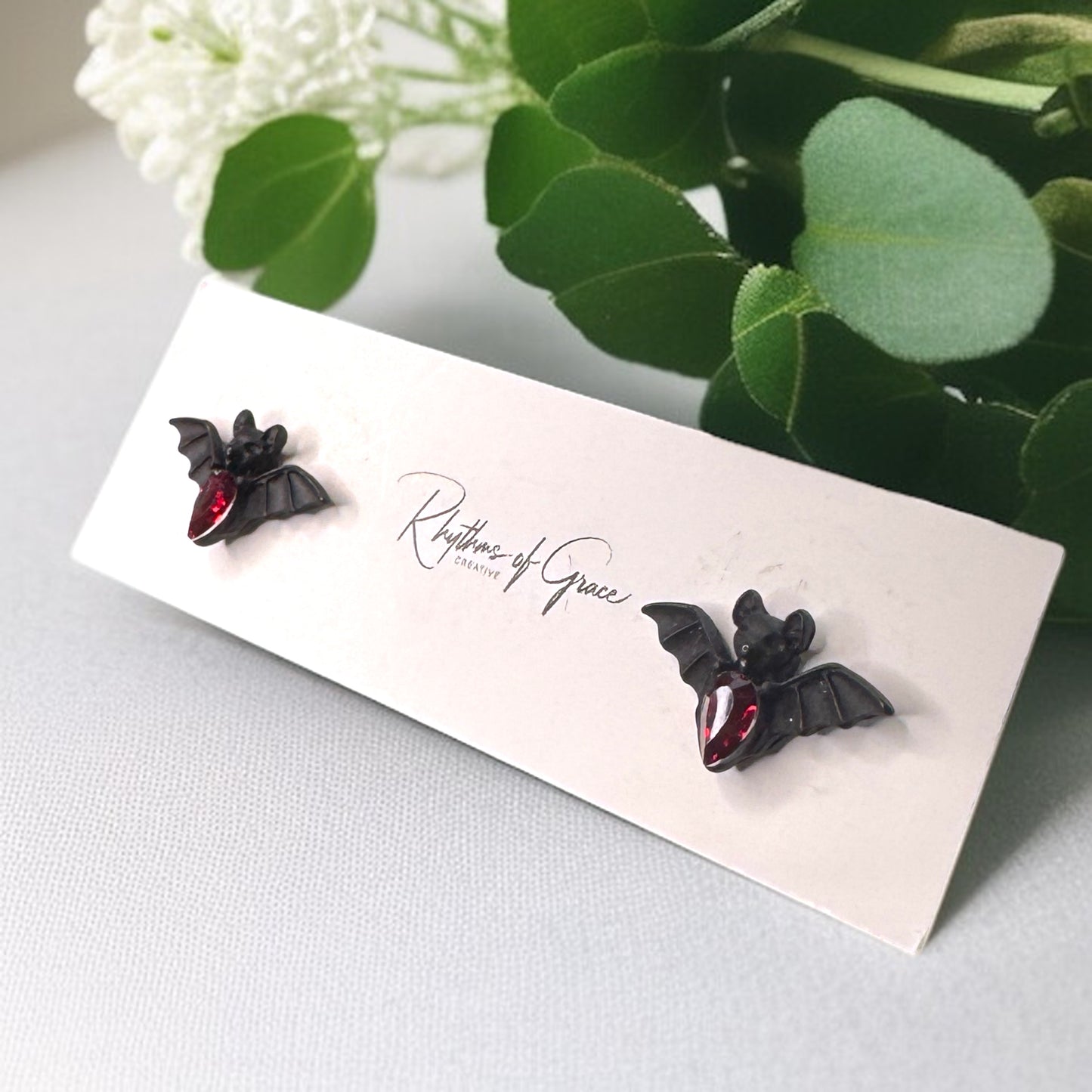 Bat-tastic Bling: Red & Black Rhinestone Stud Earrings!