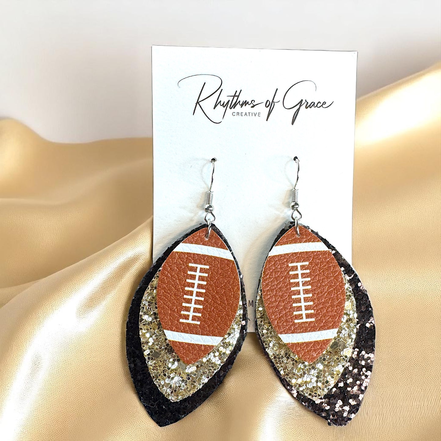 Game Day Glam: Black and Gold Glitter Football Earrings for the Ultimate Fan!