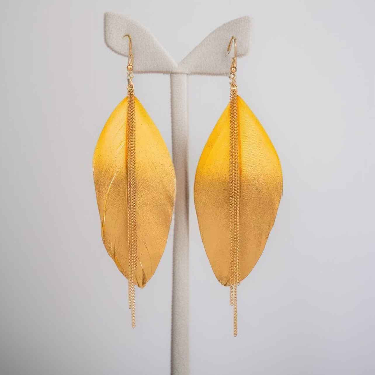Gold Dipped Feather Earrings: Dance Into the Festivity!