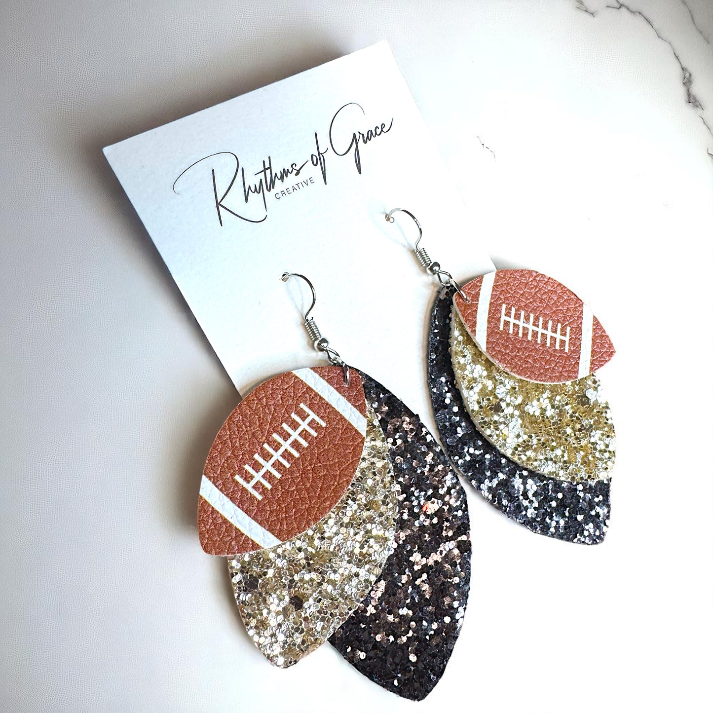 Game Day Glam: Black and Gold Glitter Football Earrings for the Ultimate Fan!