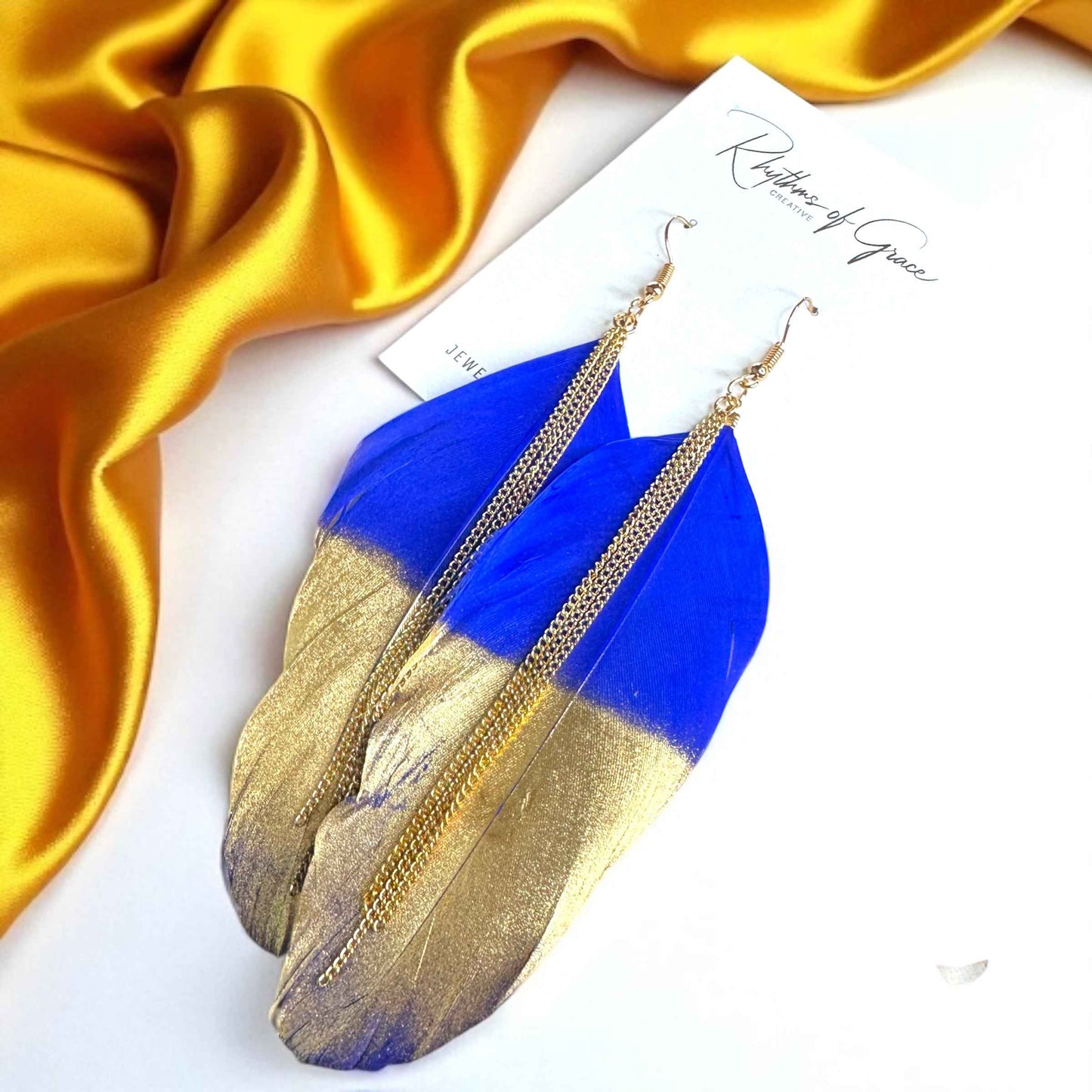 Gold Dipped Feather Earrings: Dance Into the Festivity!
