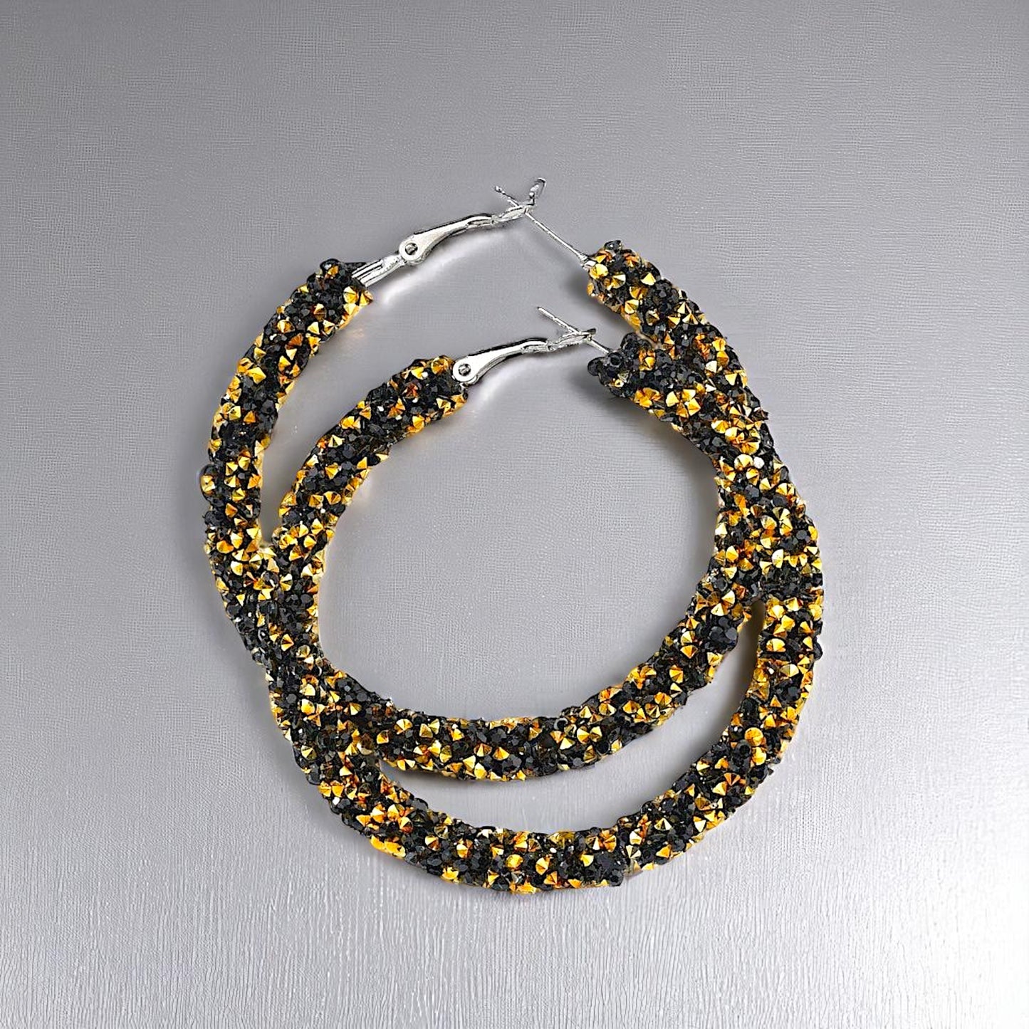 Shimmering Elegance: Black and Gold Glitter Hoops