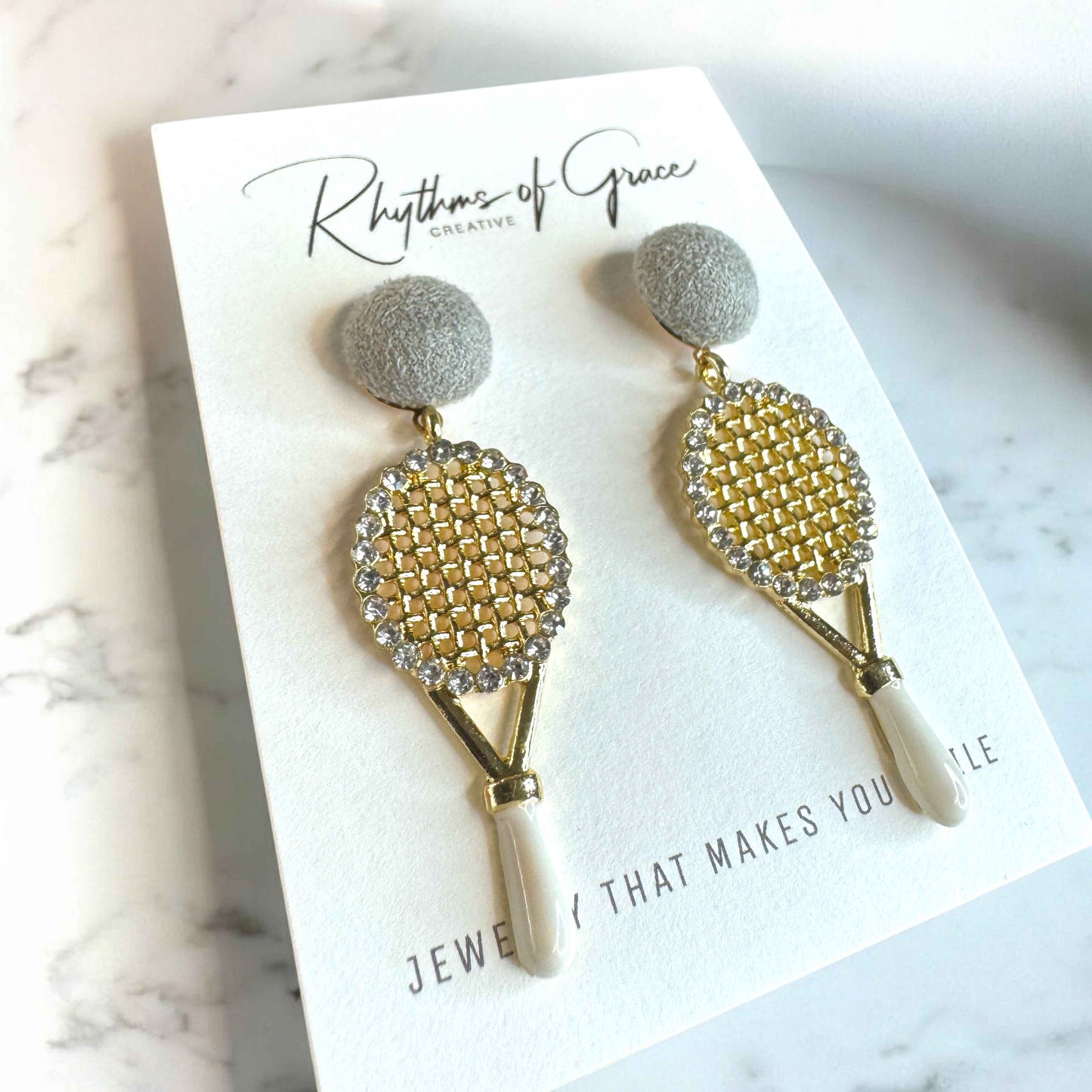 Sparkle on the Court with Our Rhinestone Tennis Racket Dangle Earrings! 🎾