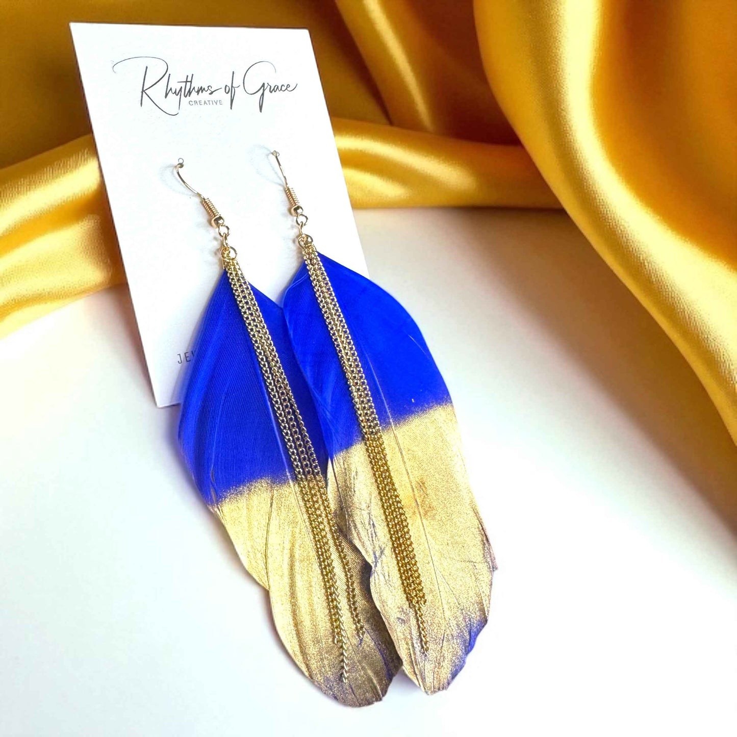 Gold Dipped Feather Earrings: Dance Into the Festivity!