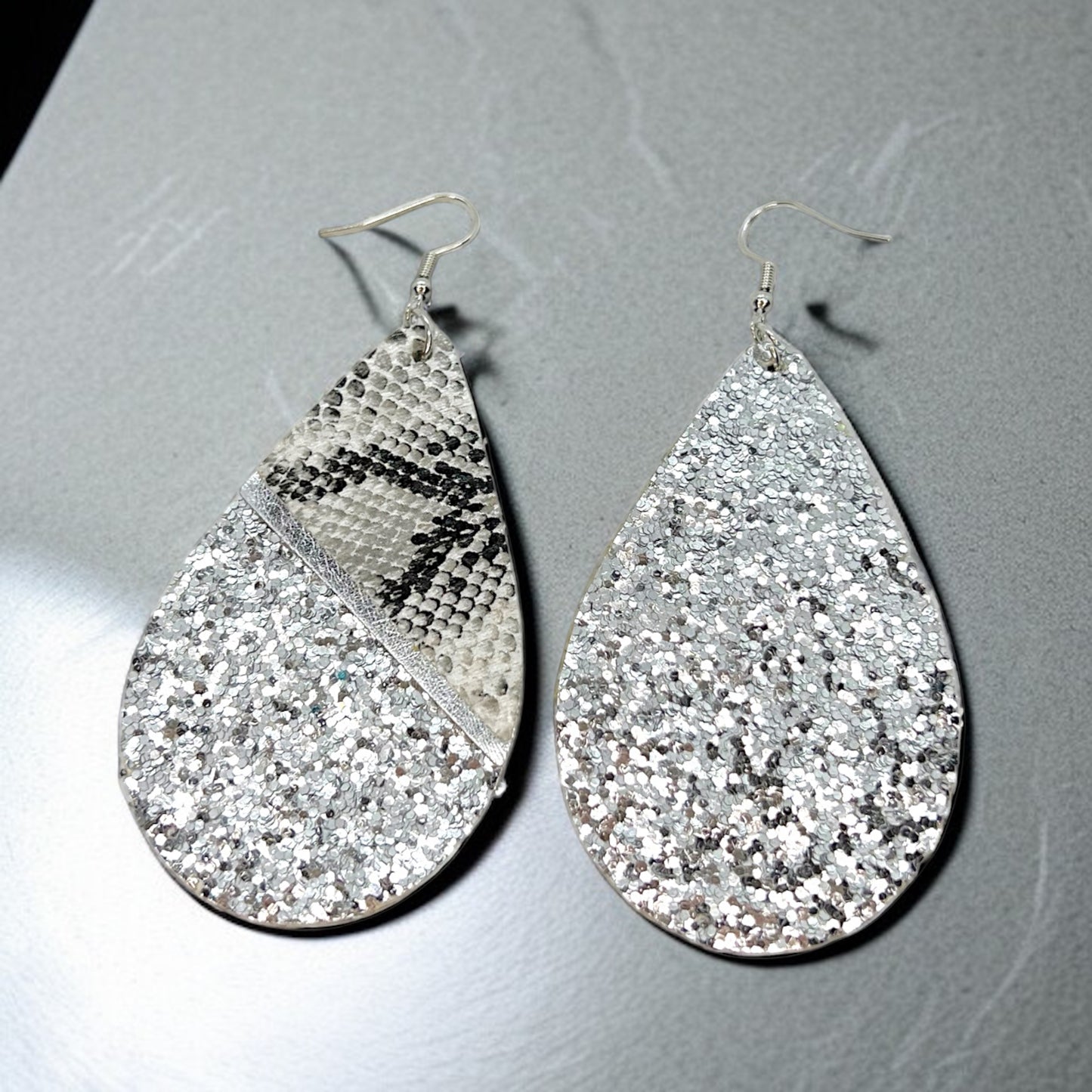 Slither in Style with Our Snake Print Teardrop Dangle Earrings! 🐍