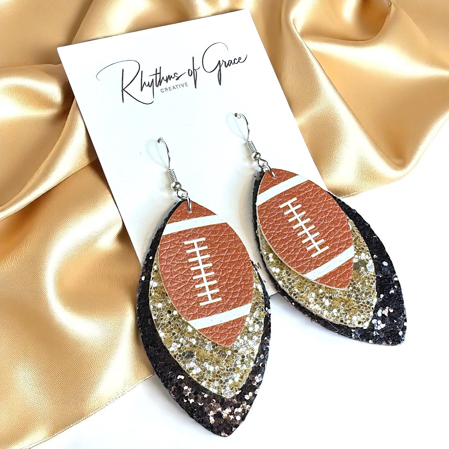 Game Day Glam: Black and Gold Glitter Football Earrings for the Ultimate Fan!