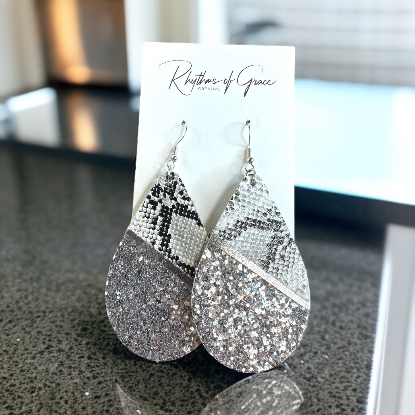Slither in Style with Our Snake Print Teardrop Dangle Earrings! 🐍