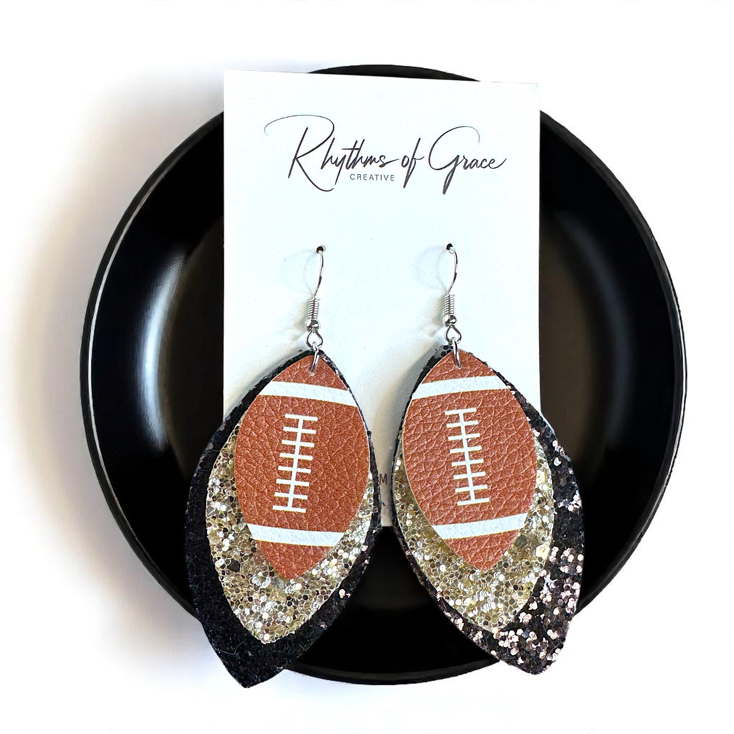 Game Day Glam: Black and Gold Glitter Football Earrings for the Ultimate Fan!