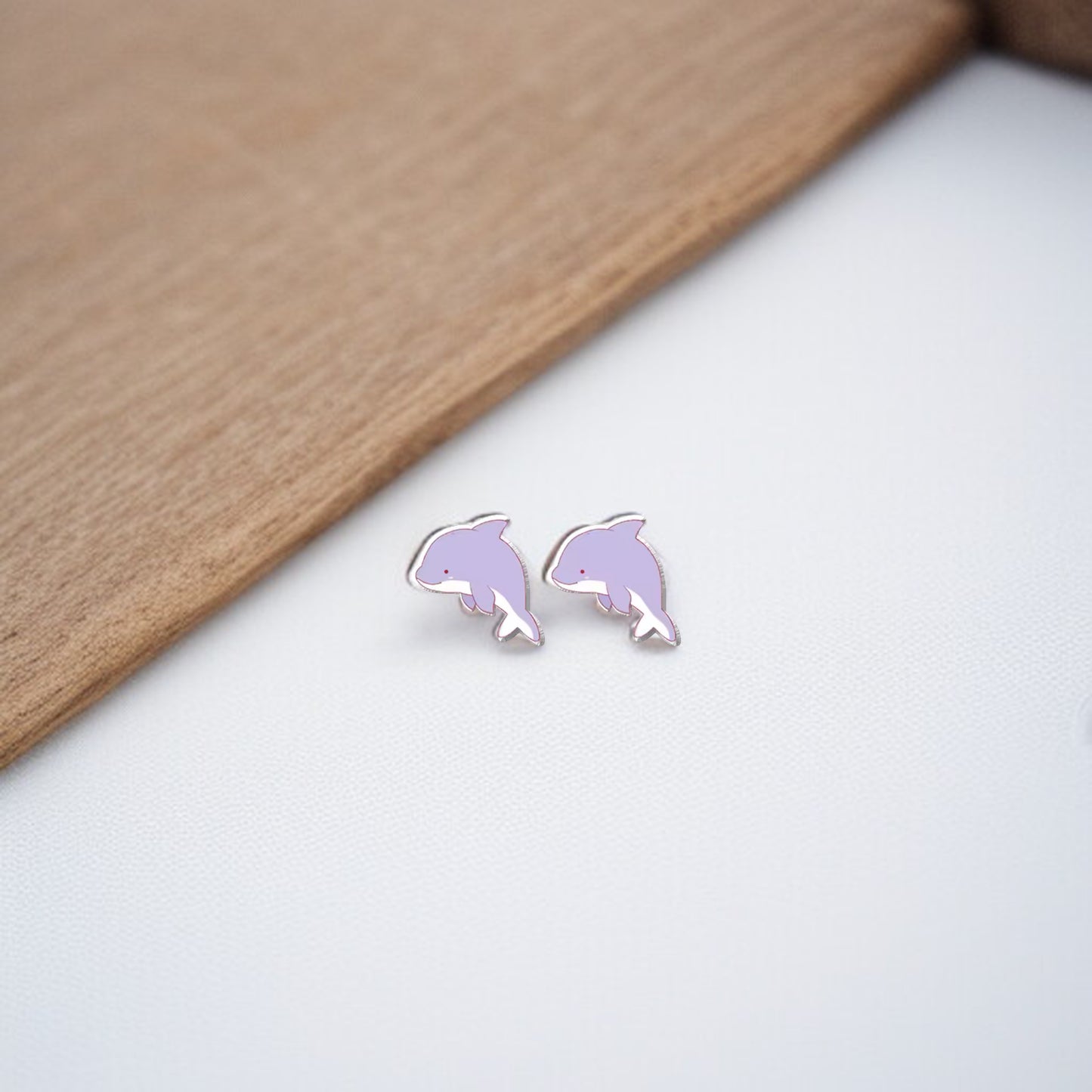 Make a Splash with Purple Dolphin Stud Earrings!