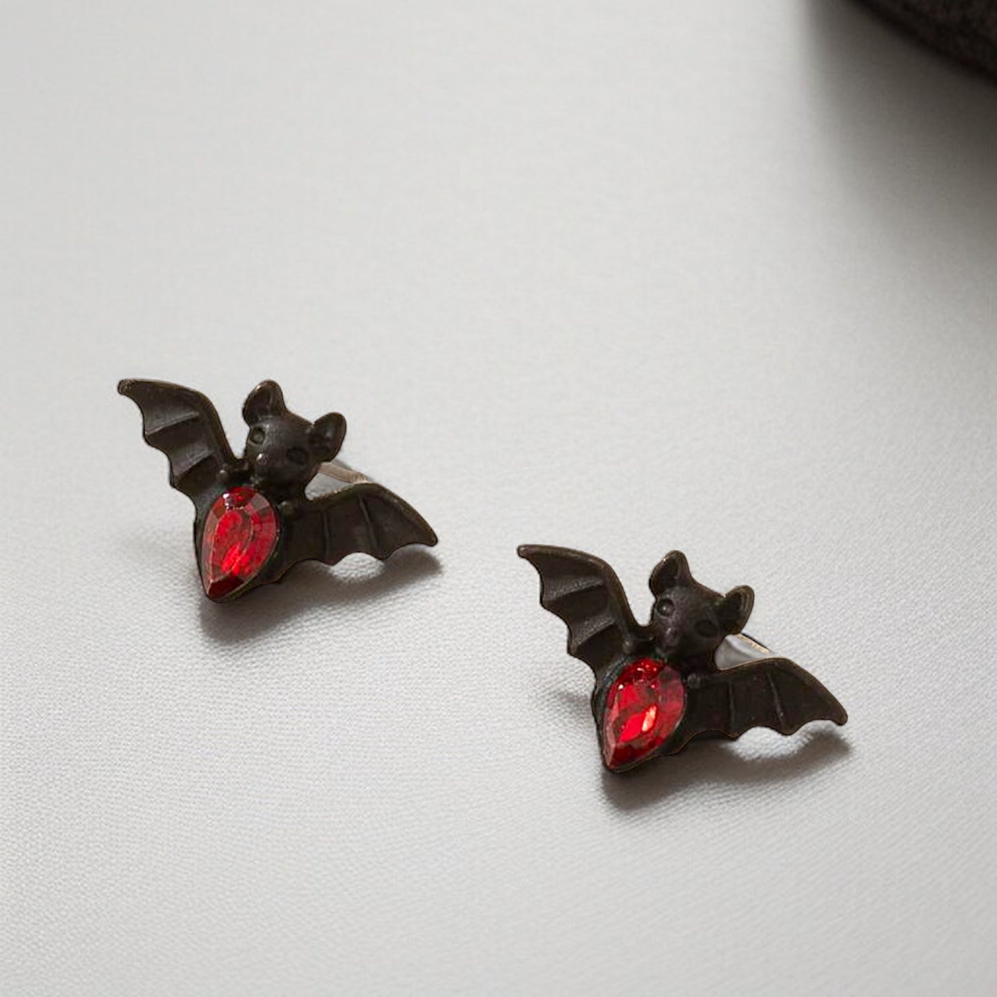 Bat-tastic Bling: Red & Black Rhinestone Stud Earrings!