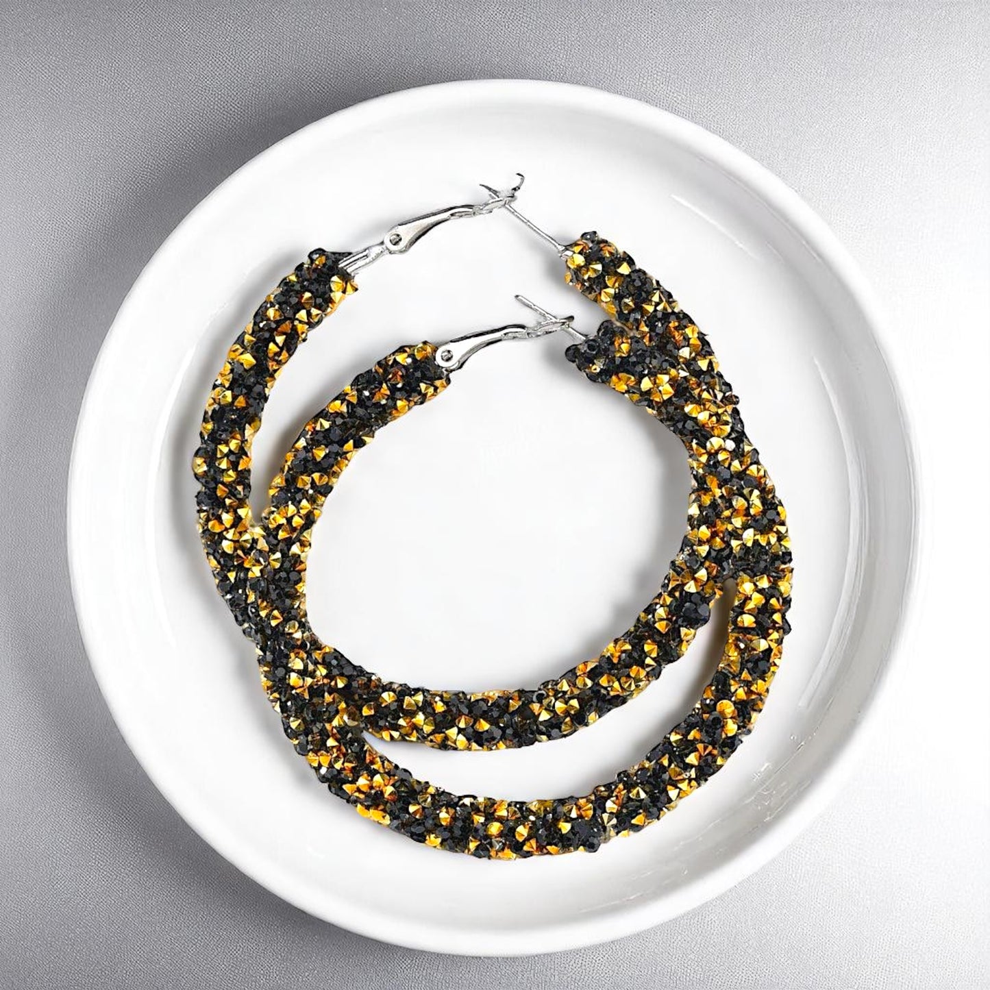 Shimmering Elegance: Black and Gold Glitter Hoops