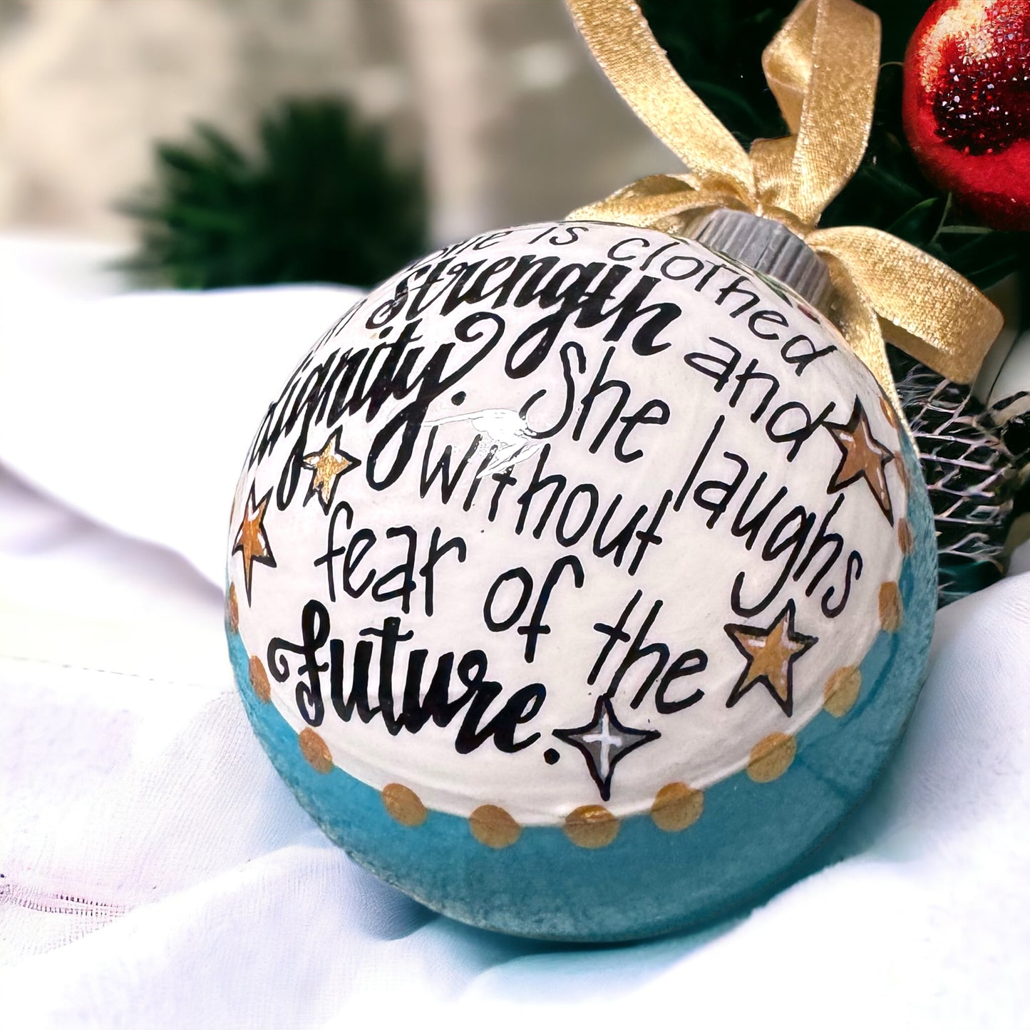 Christmas Ornament: “She is clothed in strength and dignity. She laughs without fear of the future.”