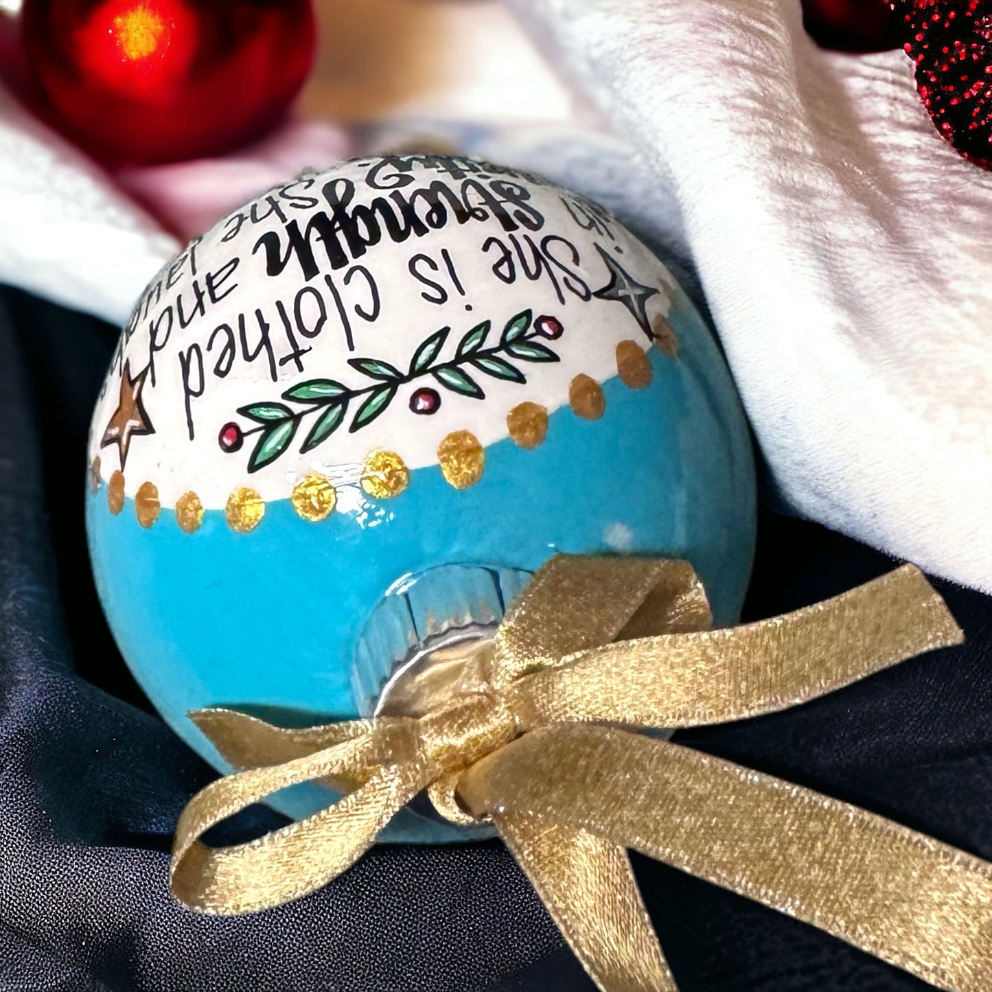 Christmas Ornament: “She is clothed in strength and dignity. She laughs without fear of the future.”