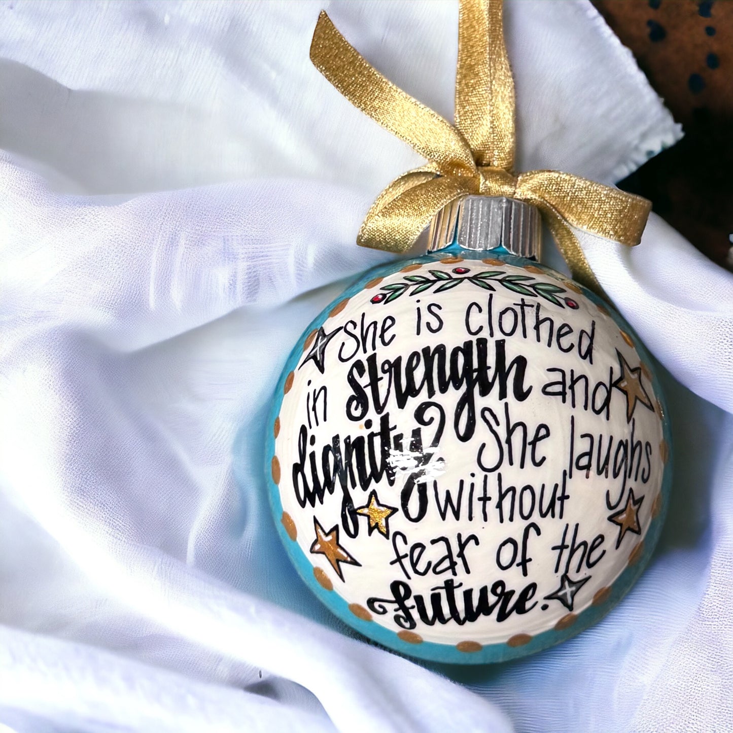 Christmas Ornament: “She is clothed in strength and dignity. She laughs without fear of the future.”