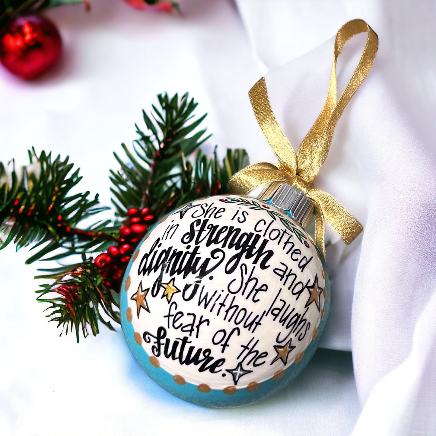 Christmas Ornament: “She is clothed in strength and dignity. She laughs without fear of the future.”