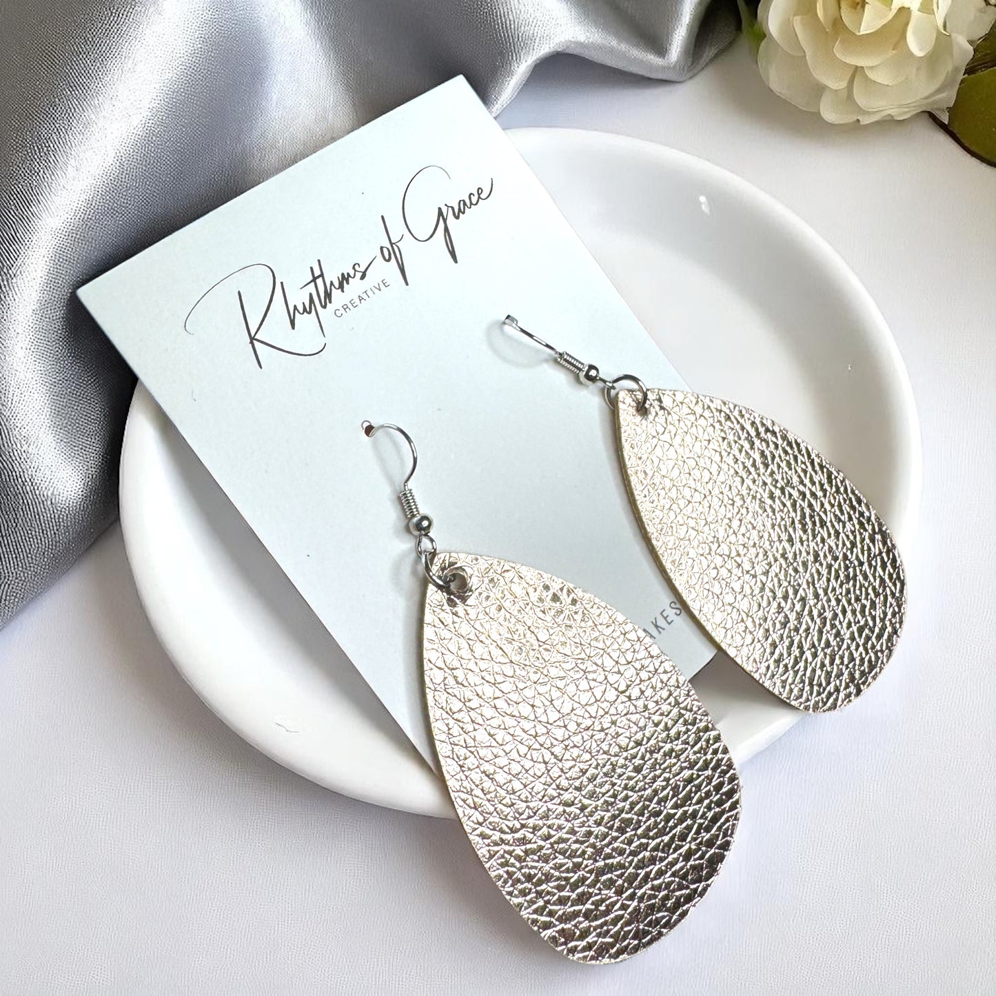 Sparkle & Shine: Metallic Teardrop Faux Leather Earrings! 🌟