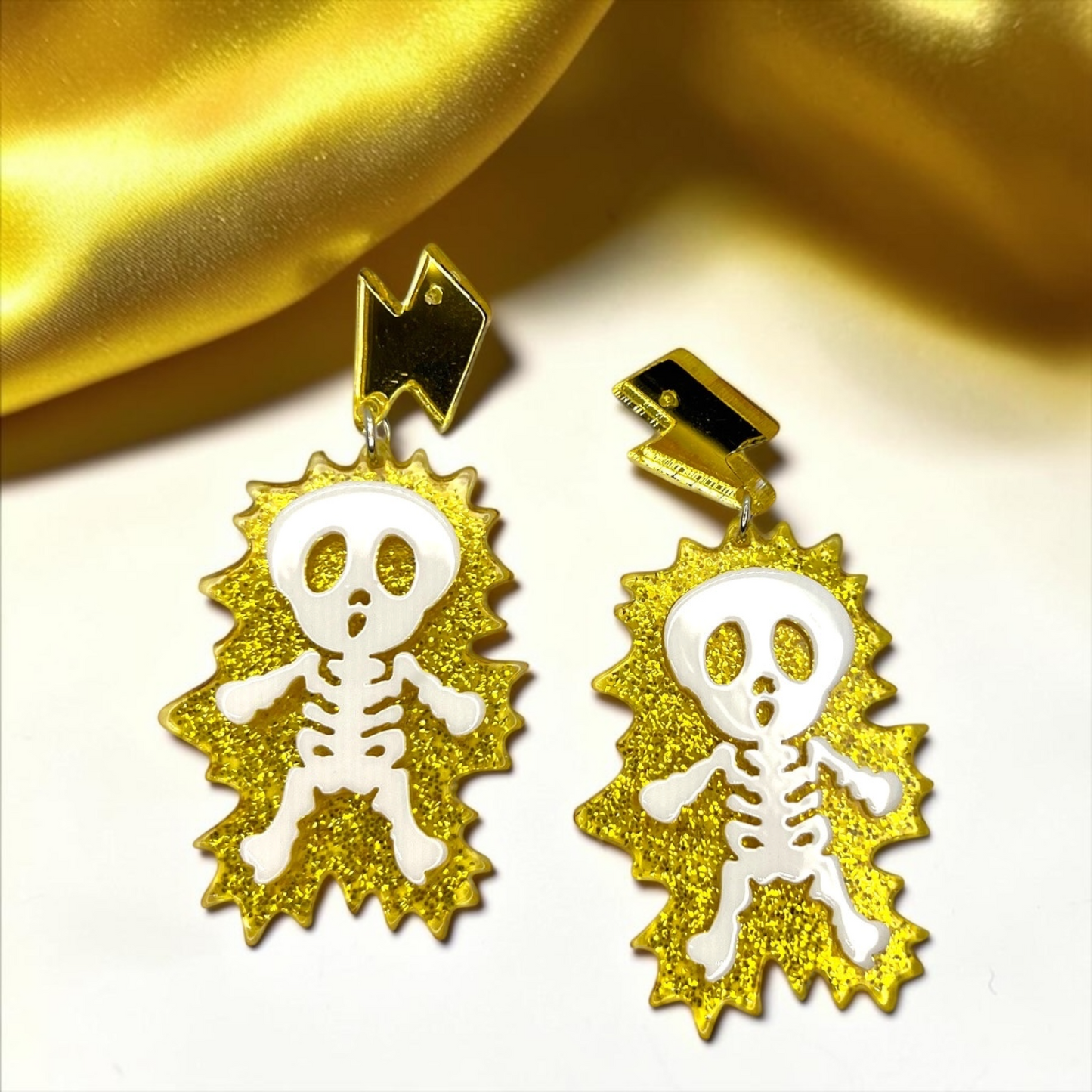 Electrify Your Look: Gold Electrocuted Skeleton Dangle Earrings for a Spook-tacular Style!