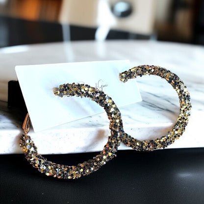 Shimmering Elegance: Black and Gold Glitter Hoops