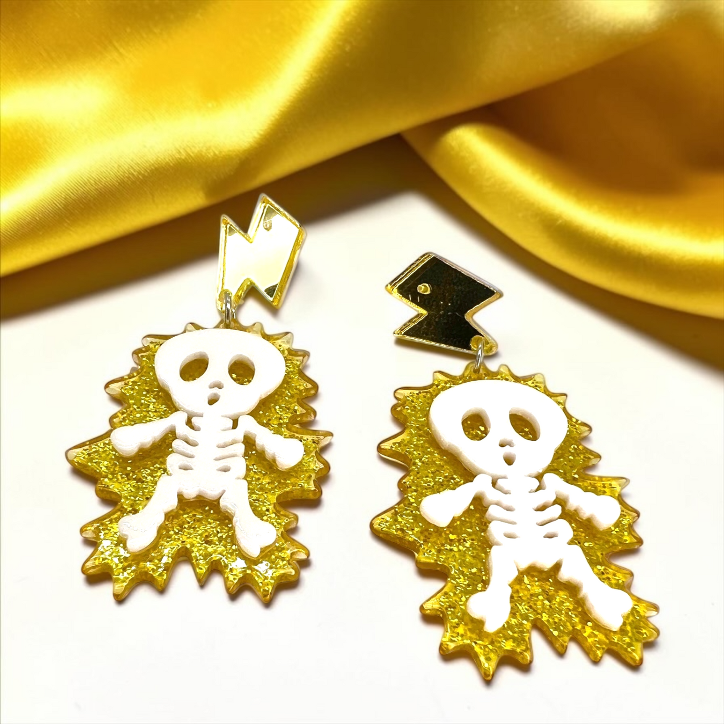 Electrify Your Look: Gold Electrocuted Skeleton Dangle Earrings for a Spook-tacular Style!