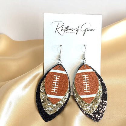 Game Day Glam: Black and Gold Glitter Football Earrings for the Ultimate Fan!