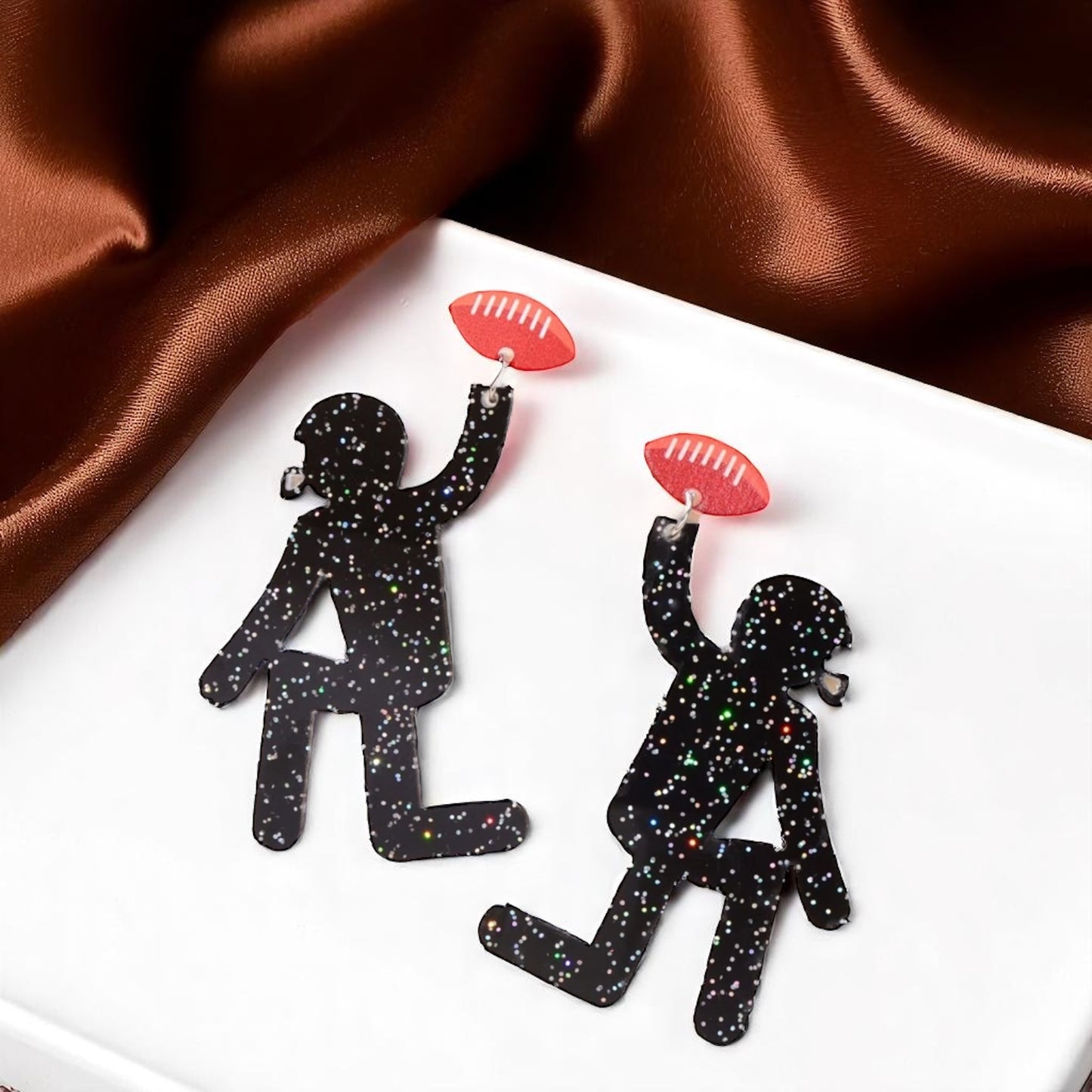 Touchdown Style: Football Player Dangle Earrings 🏈