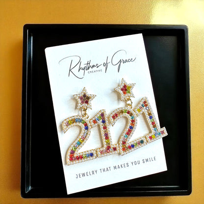 Sparkle into 21 with Our Rhinestone “21” Dangle Earrings!
