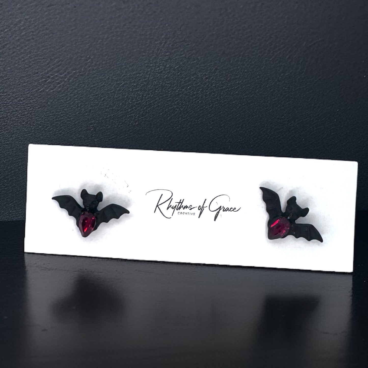 Bat-tastic Bling: Red & Black Rhinestone Stud Earrings!