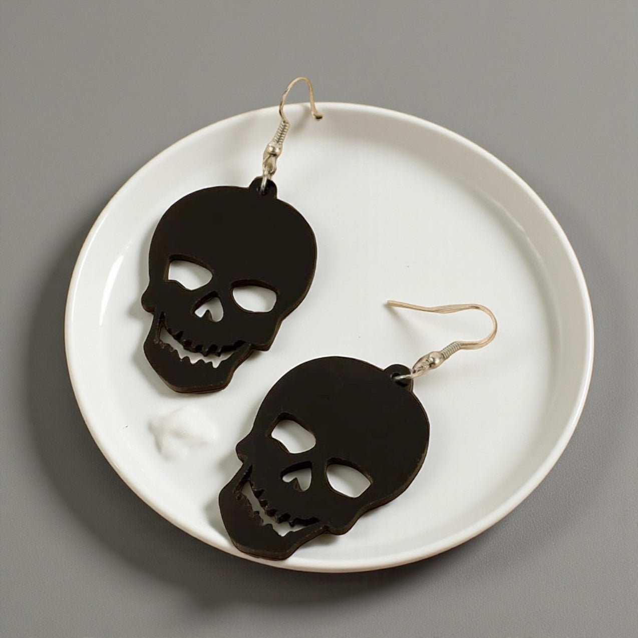 Spooky Chic: Black Skull Dangle Earrings for the Bold at Heart!