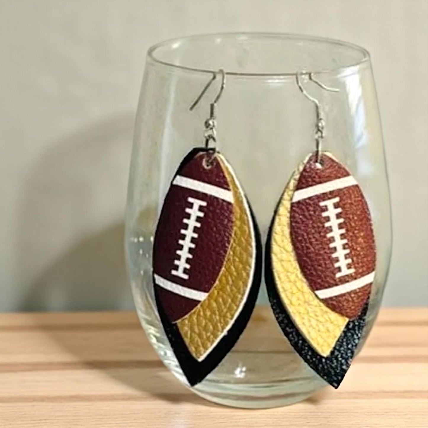 Touchdown in Style: Black and Gold Football Earrings for the Fashion-Forward Fan!