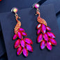 Radiant Peacock Glam Earrings – Feather Your Style with Sparkle!