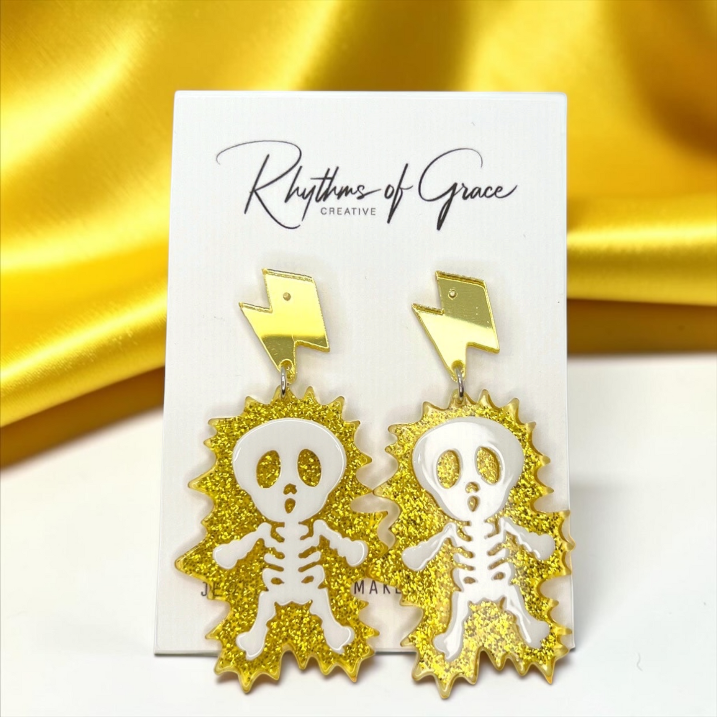 Electrify Your Look: Gold Electrocuted Skeleton Dangle Earrings for a Spook-tacular Style!