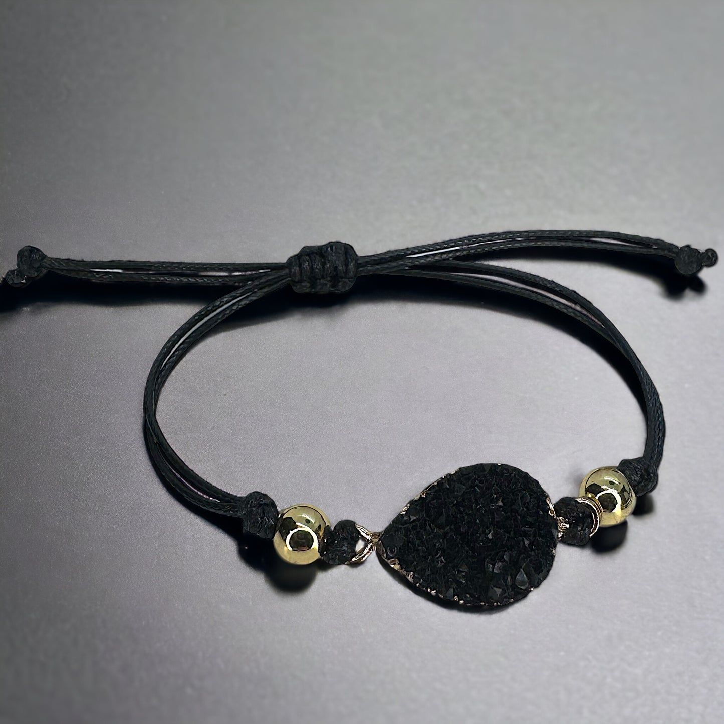 Black Leather Bracelet with Gold and Black Charm