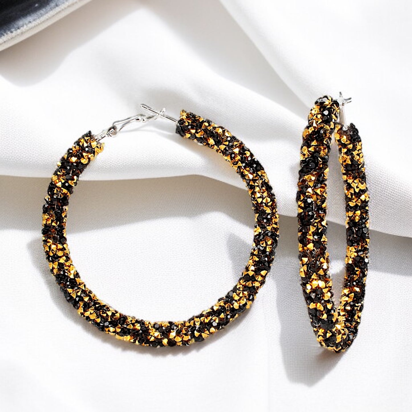 Shimmering Elegance: Black and Gold Glitter Hoops