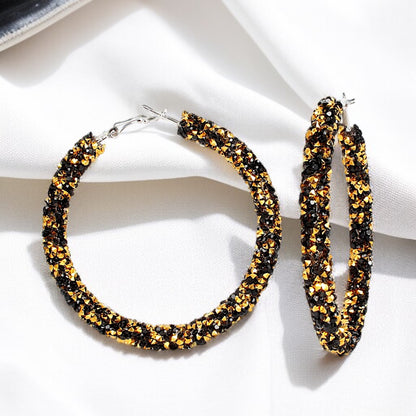 Shimmering Elegance: Black and Gold Glitter Hoops