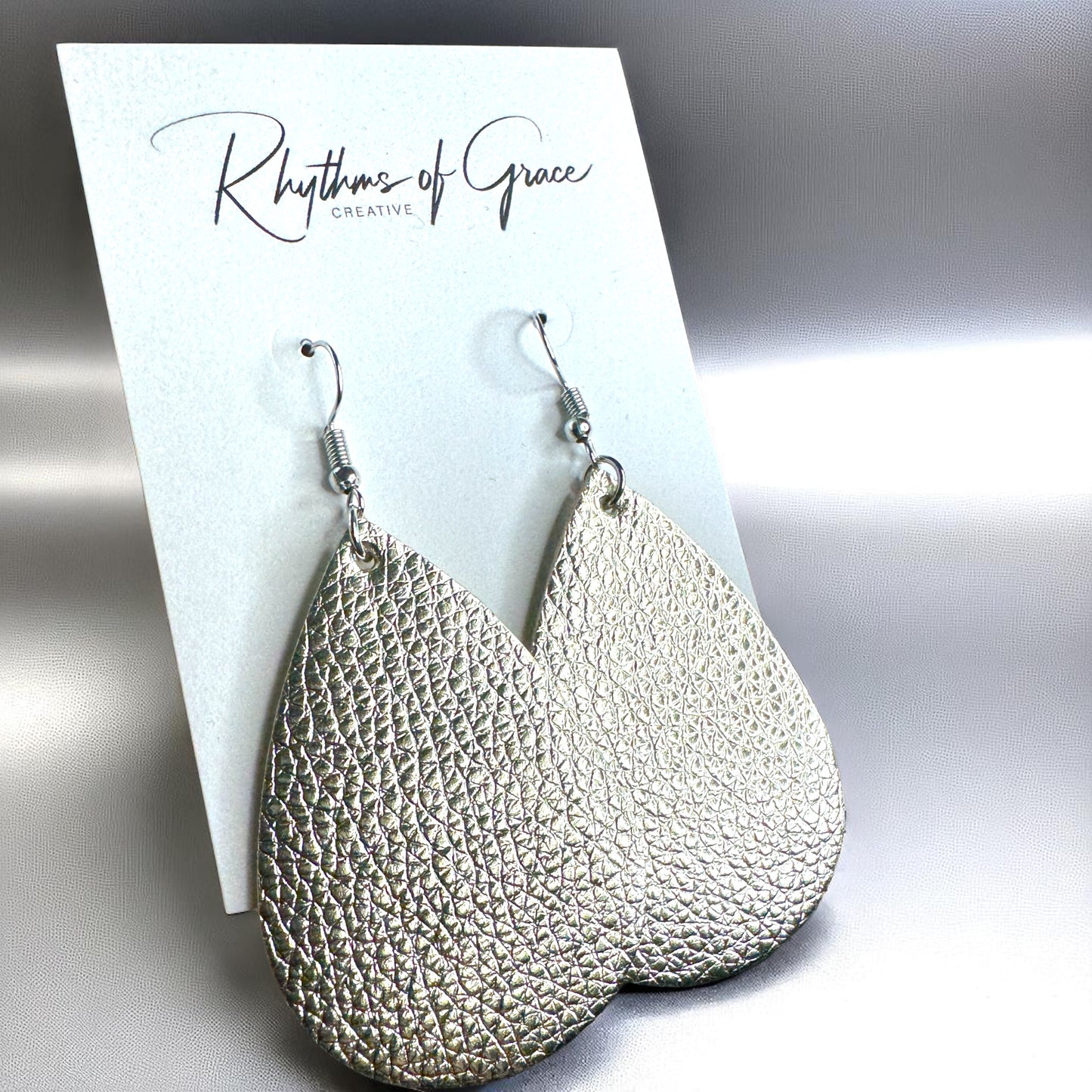 Sparkle & Shine: Metallic Teardrop Faux Leather Earrings! 🌟