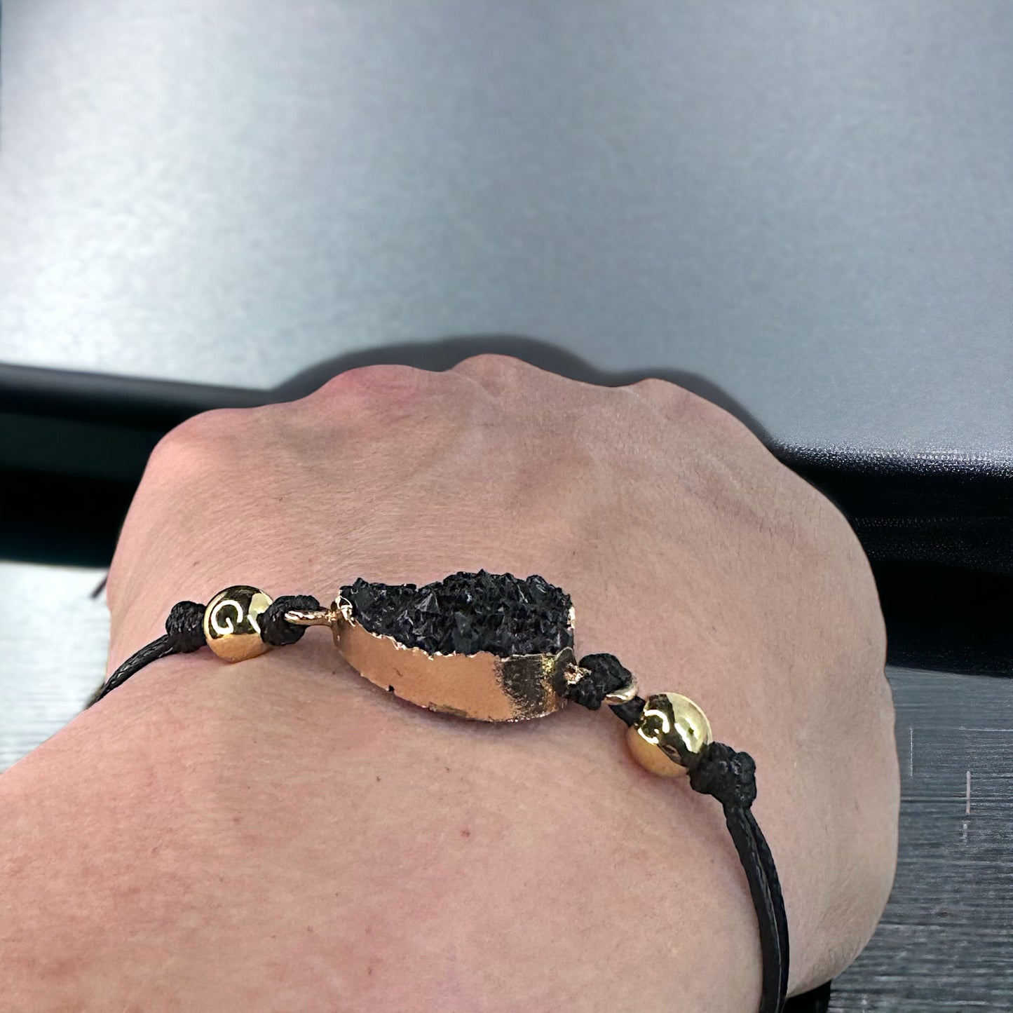 Black Leather Bracelet with Gold and Black Charm