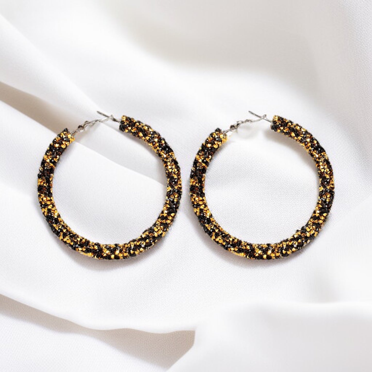 Shimmering Elegance: Black and Gold Glitter Hoops