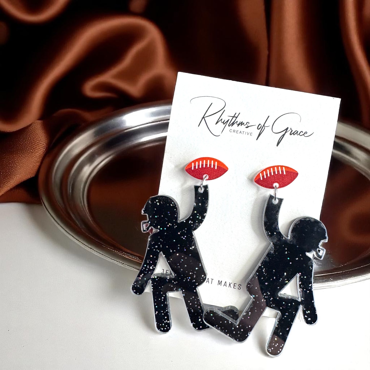 Touchdown Style: Football Player Dangle Earrings 🏈