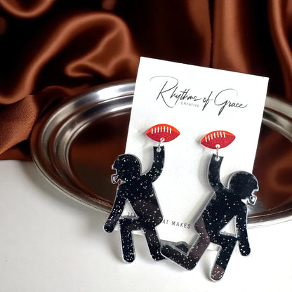 Touchdown Style: Football Player Dangle Earrings 🏈
