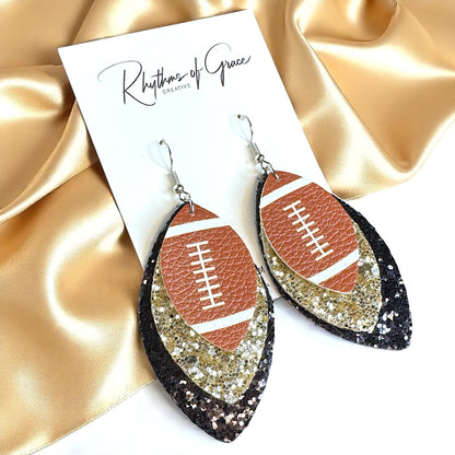 Game Day Glam: Black and Gold Glitter Football Earrings for the Ultimate Fan!