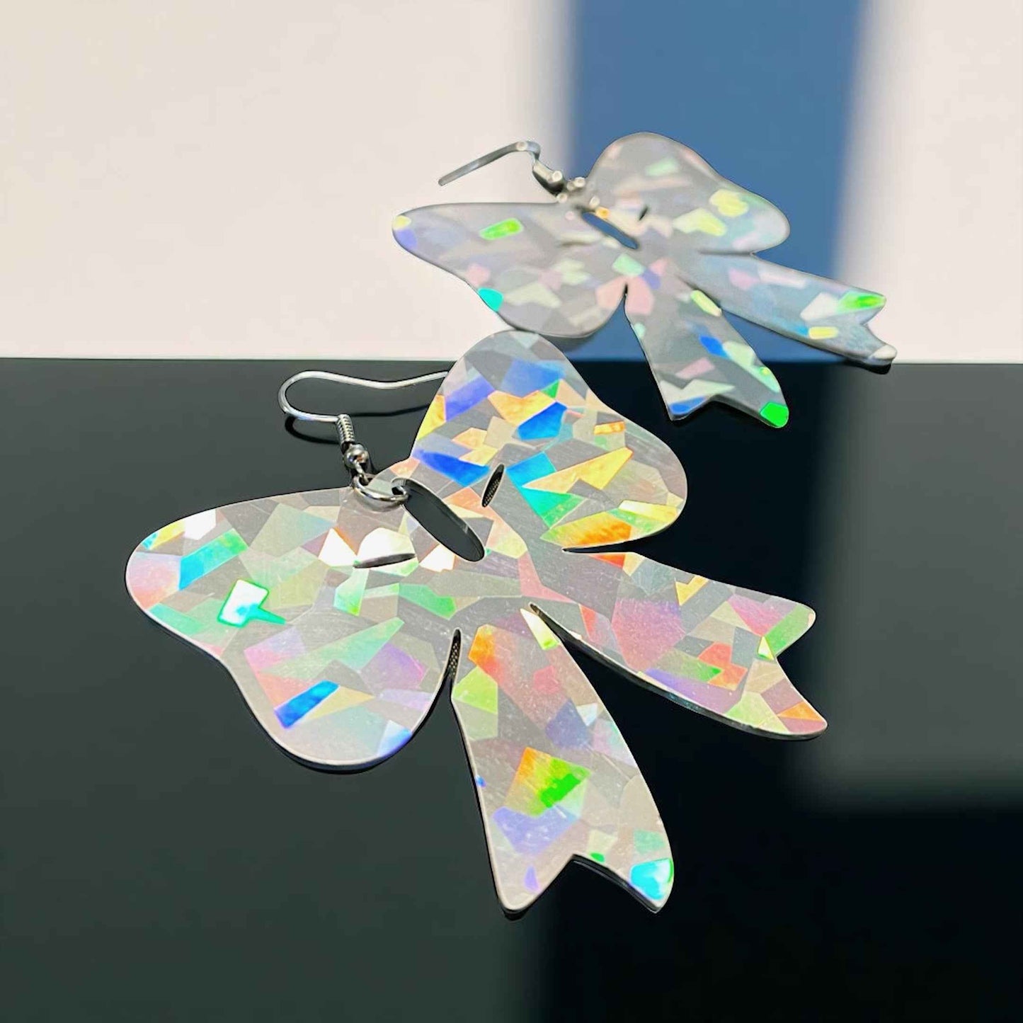 Sparkle & Spook: Holographic Bow Earrings for a Stunning Glam!