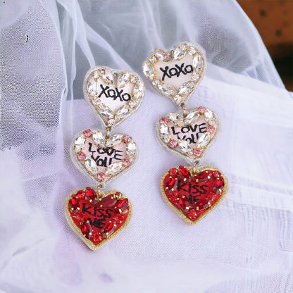 Love You, Mean It – Triple Heart Dangle Earrings