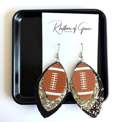 Game Day Glam: Black and Gold Glitter Football Earrings for the Ultimate Fan!