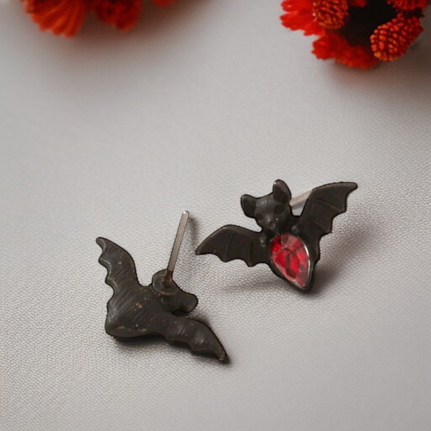 Bat-tastic Bling: Red & Black Rhinestone Stud Earrings!