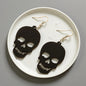 Spooky Chic: Black Skull Dangle Earrings for the Bold at Heart!