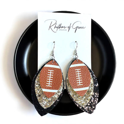 Game Day Glam: Black and Gold Glitter Football Earrings for the Ultimate Fan!