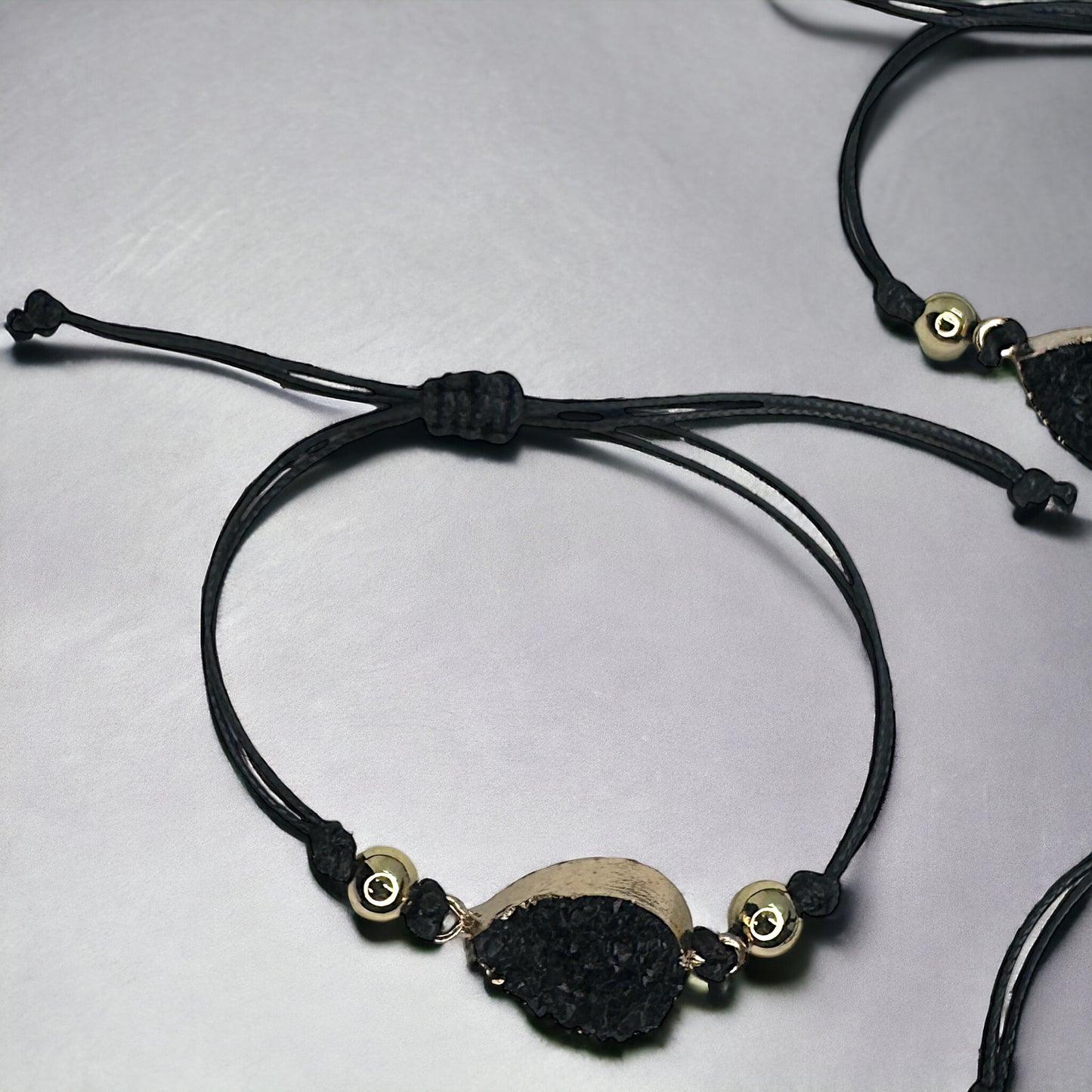 Black Leather Bracelet with Gold and Black Charm